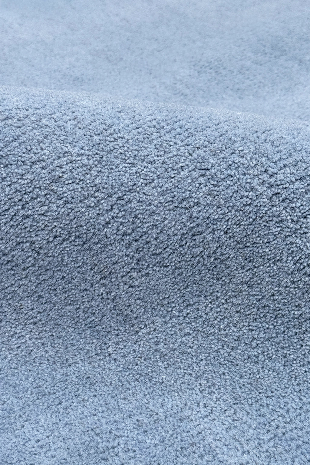 Close-up of a textured blue square ruh surface