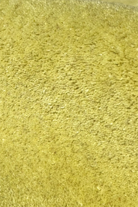 Close-up of a textured bright green wool rug