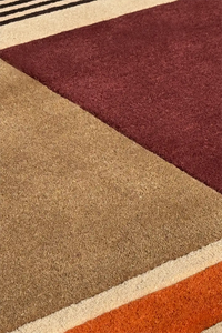 Moody modern color block tufted rug in burgundy, rust, and espresso tones