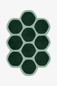 hexagon rug in irregular shape with custom green and sage wool colors