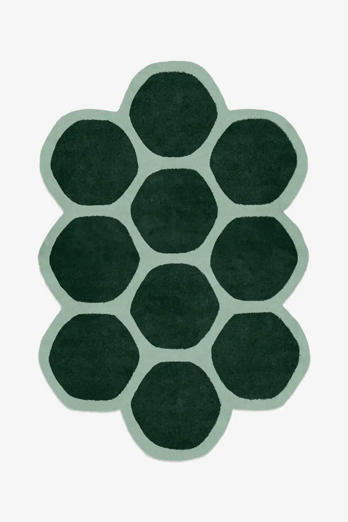 hexagon rug in irregular shape with custom green and sage wool colors