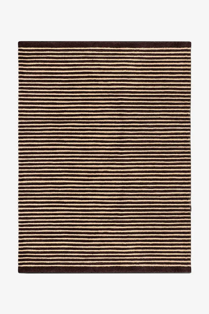 Neutral wool area rug with thin brown and tan stripes in a classic modern pattern