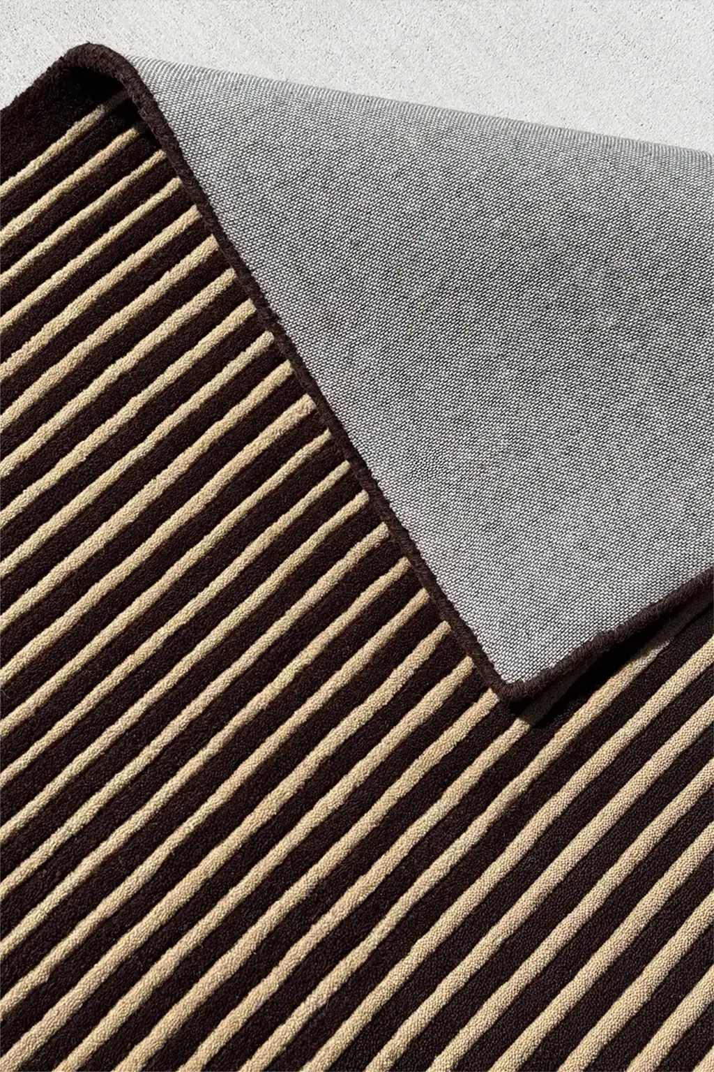 Neutral luxury wool rug with modern striped tufted pattern for elevated interiors