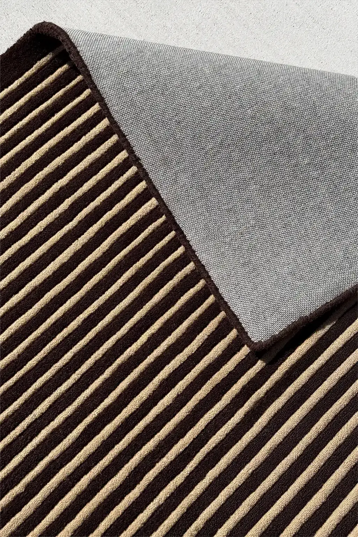 Neutral luxury wool rug with modern striped tufted pattern for elevated interiors