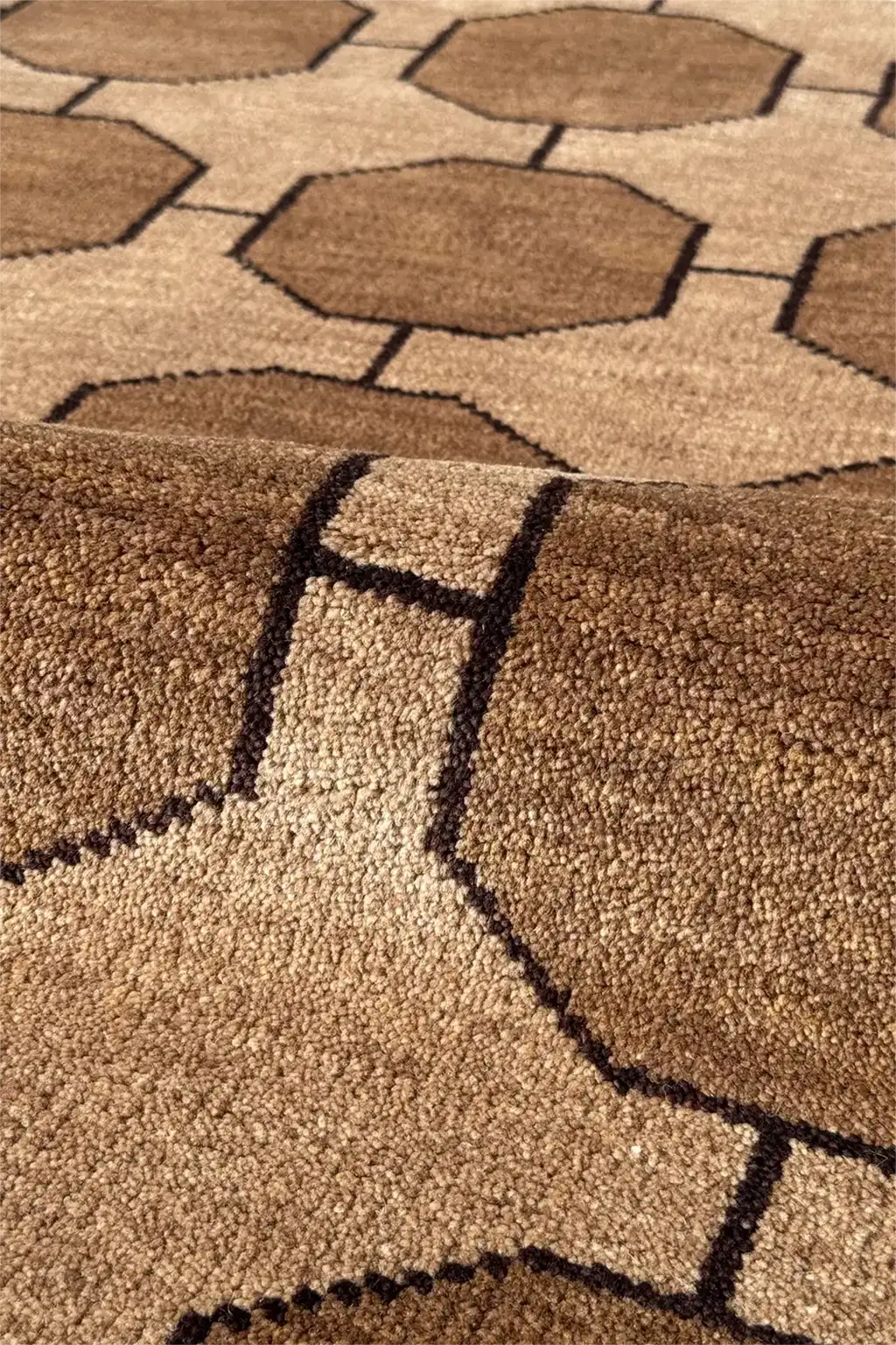 Close-up of a light brown geometric patterned rug