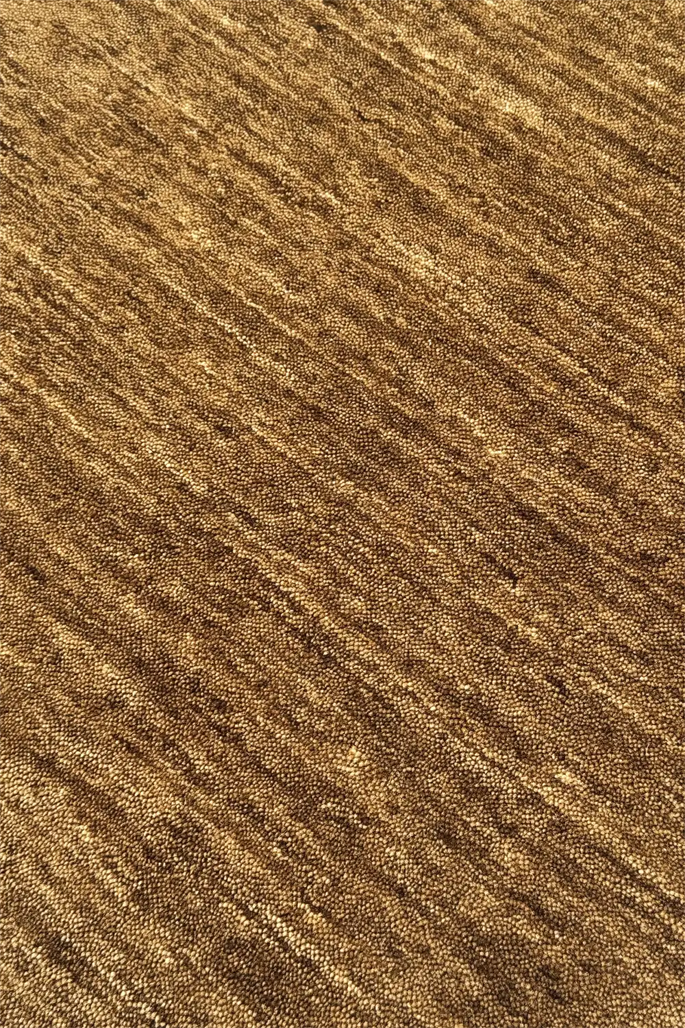 Close-up of modern ochre brown wool hand-loomed rug