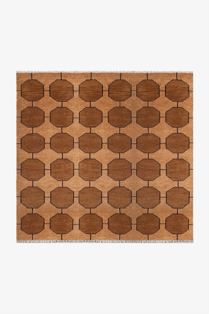 honey gold square geometric patterned rug on a white background | 6x6