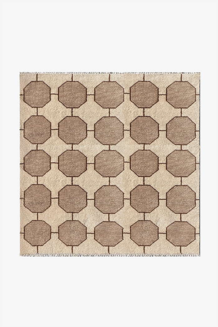 ivory and beige geometric patterned rug in a square format on a white background | 5x5