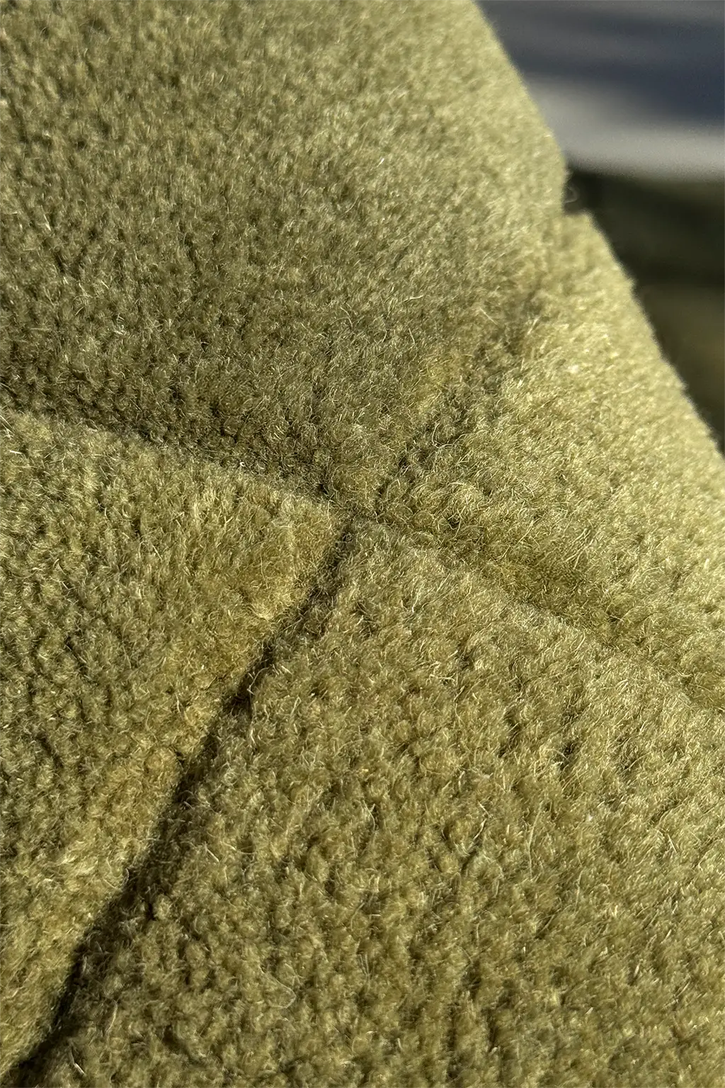 Close-up of olive green runner rug