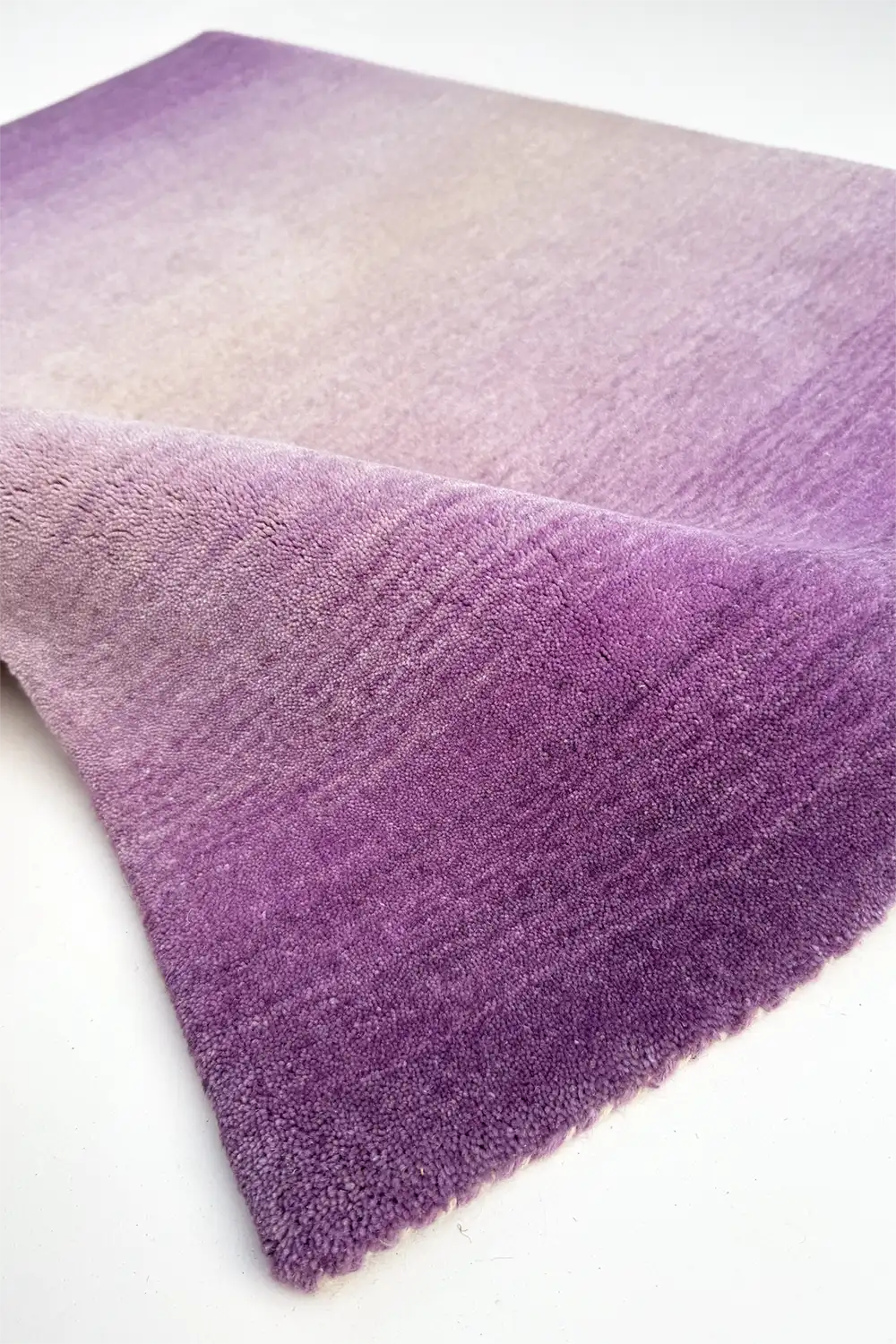 contemporary gradient purple rug on a white background