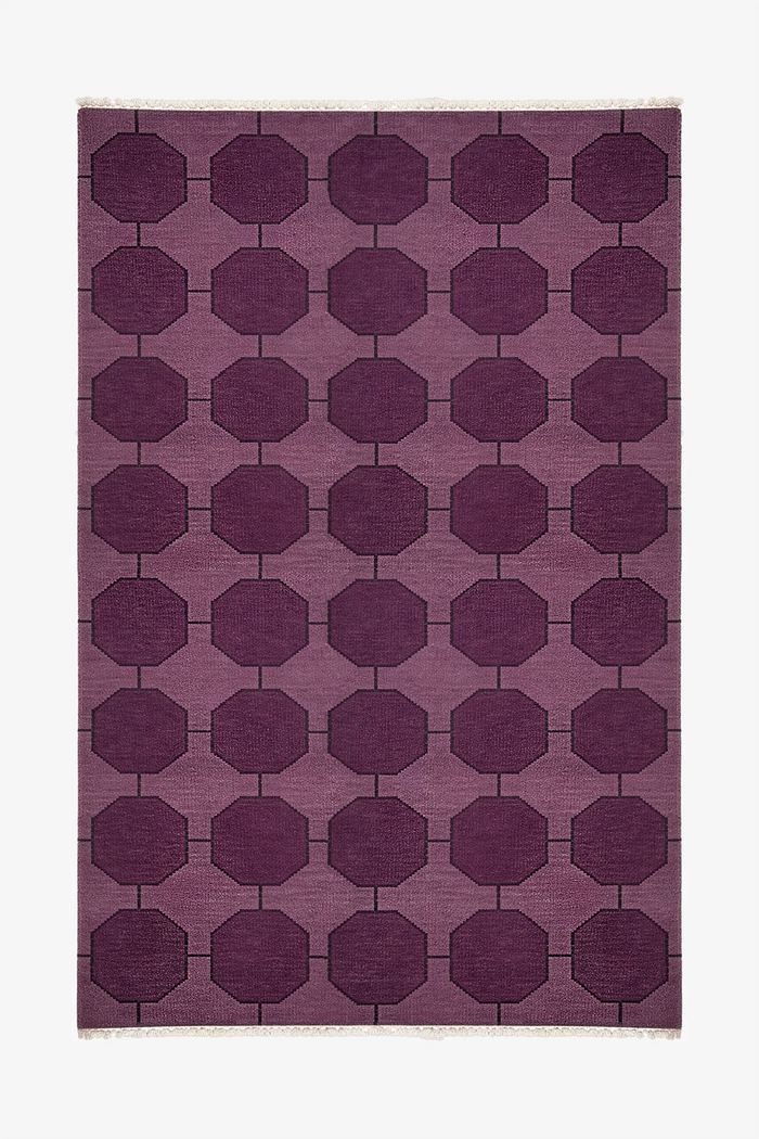 Purple geometric patterned rug made from hand-knotted wool on a white background | 5x8