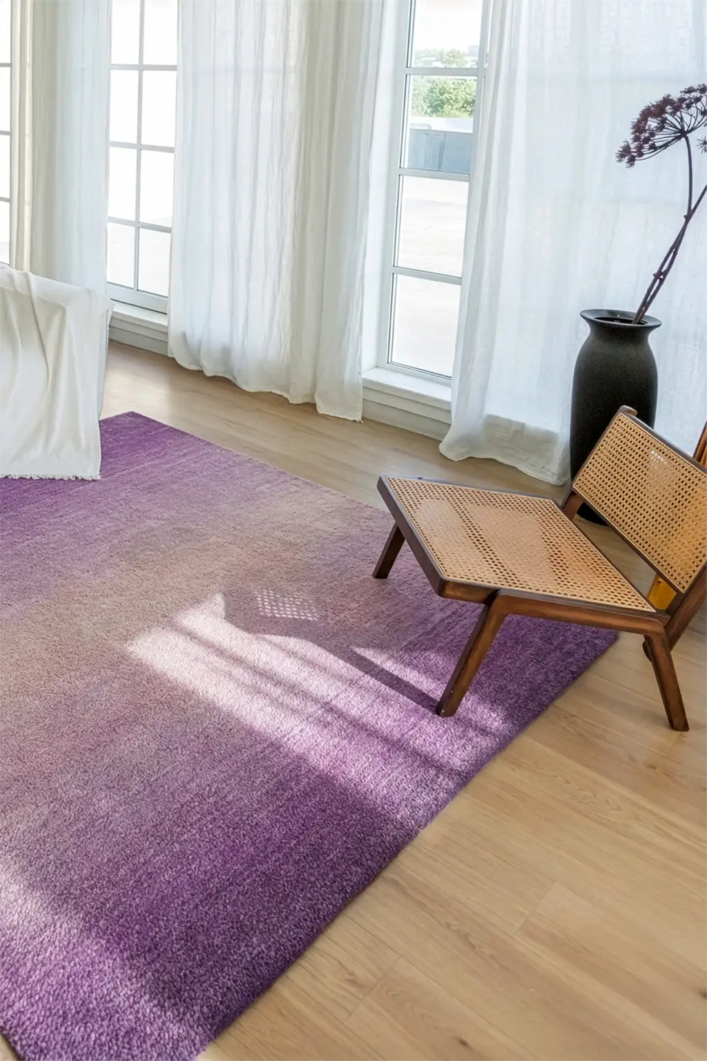 purple ombre rug in a modern living room with wooden chair lifestyle
