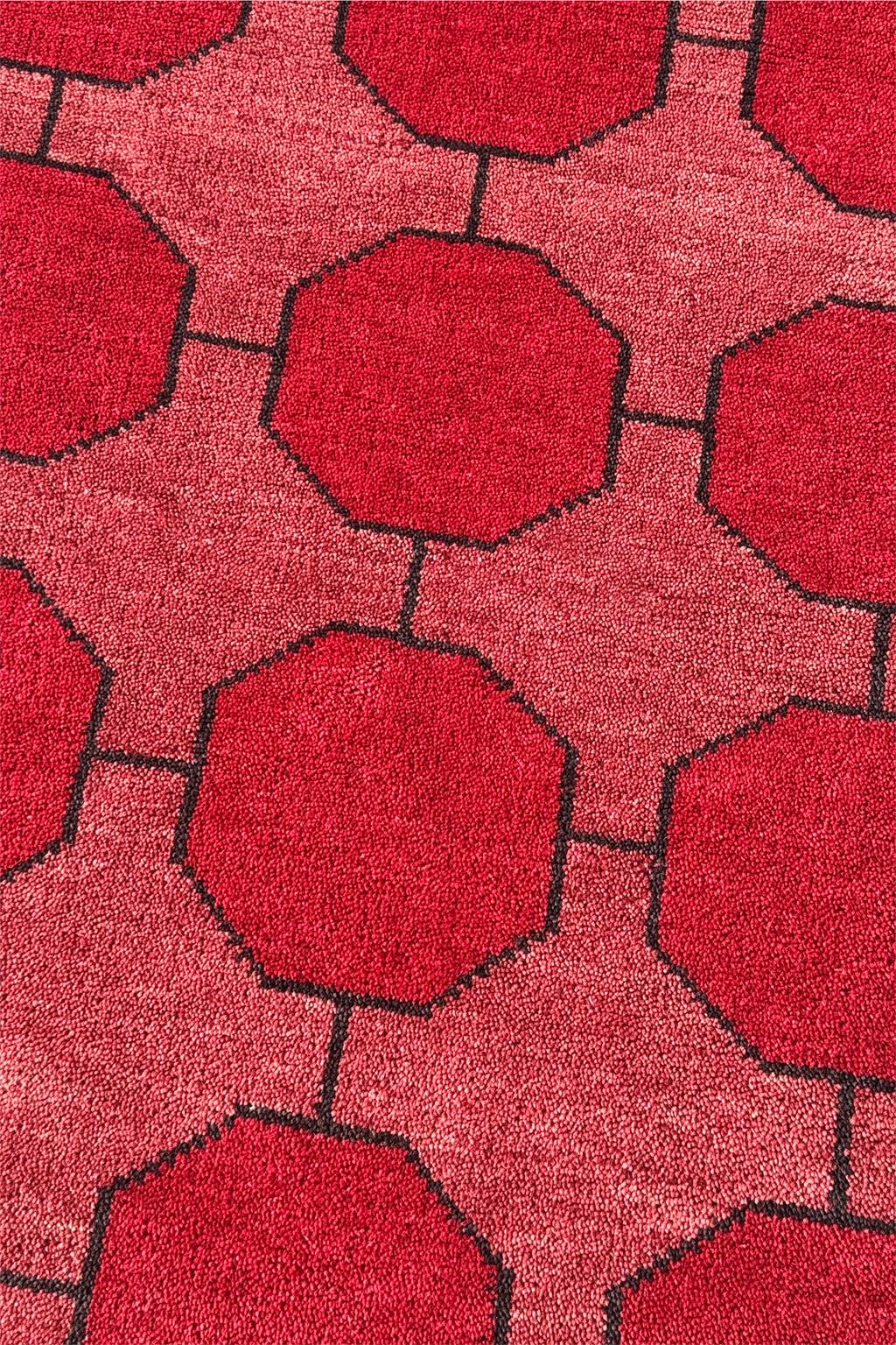Red geometric patterned rug with octagonal shapes
