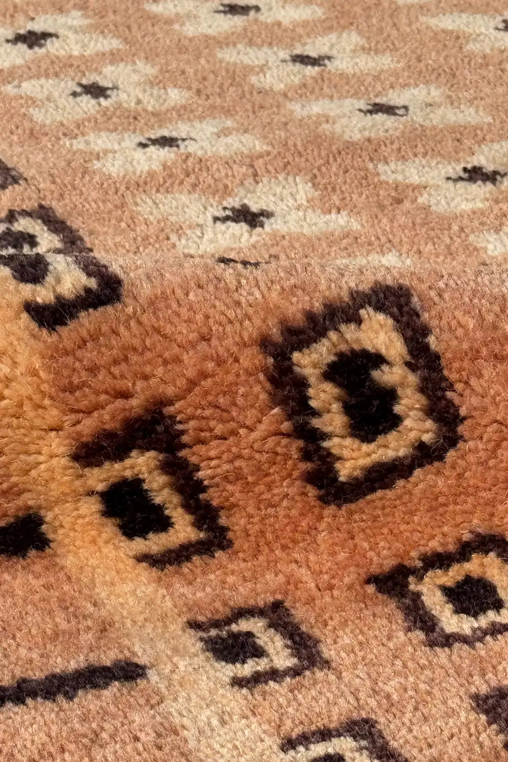 Plush wool texture on hand knotted square rug with taupe background and black geometric accents, ideal for MCM interiors