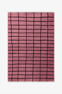 Pink checkered rug with black lines on a white background