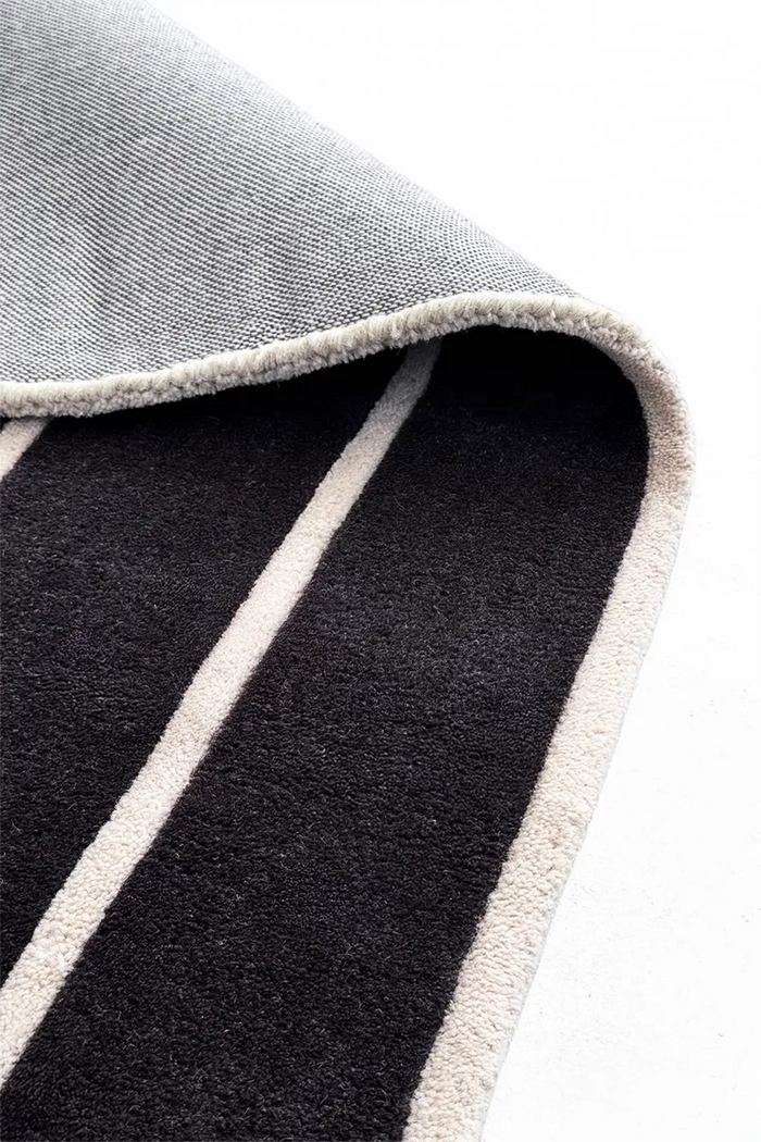 black and white wool runner rug with bound edges