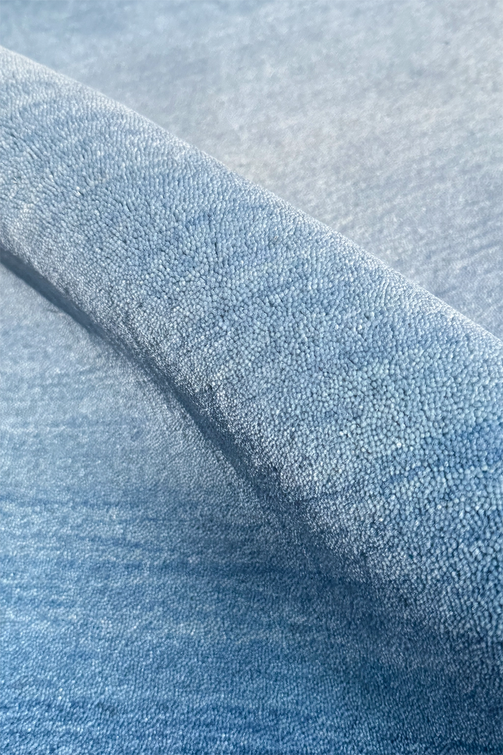 Close-up of textured blue wool runner rug