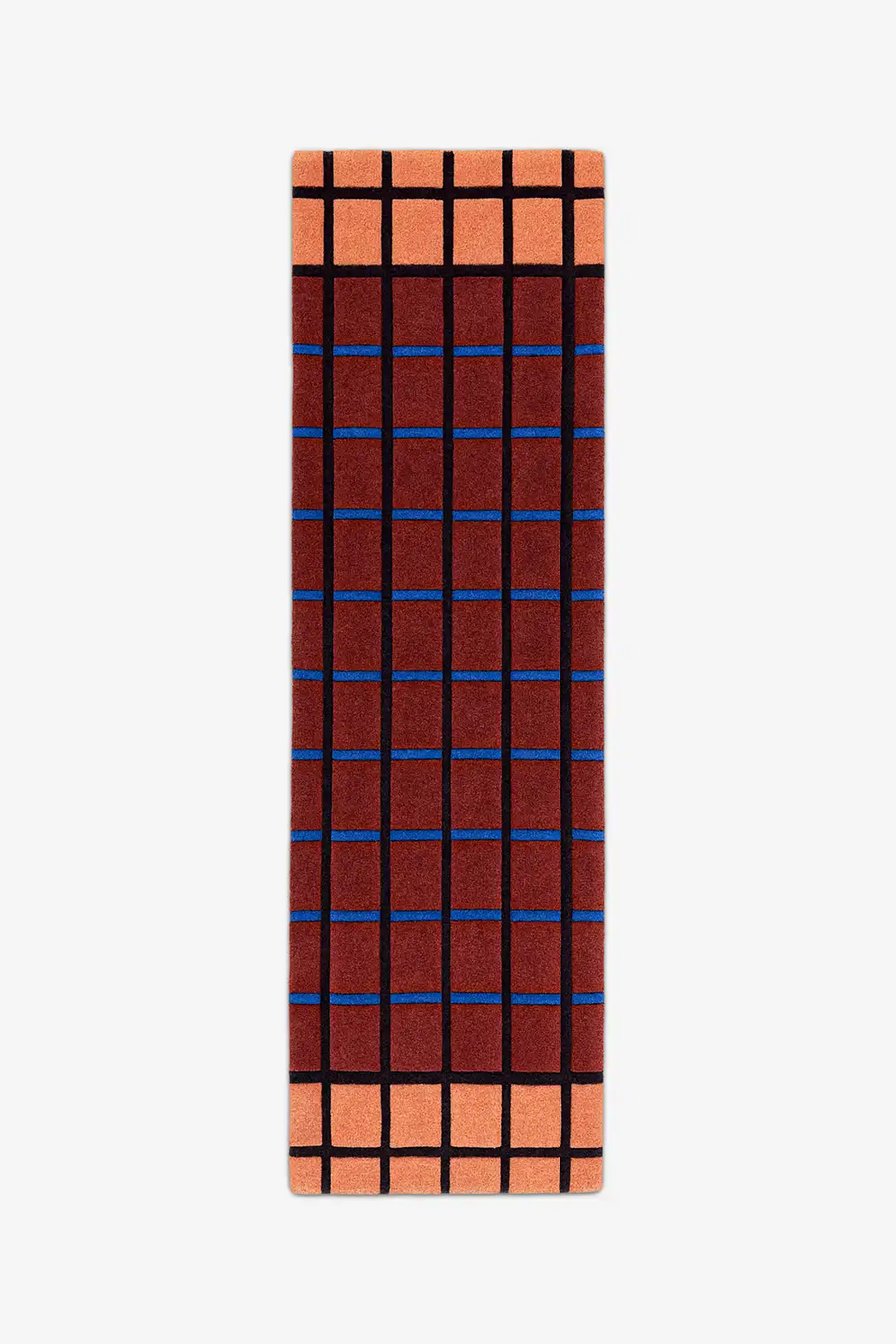 runner rug with a rust and terracotta grid pattern on a white background