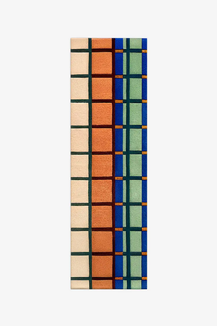runner rug with a modern geometric pattern in multicolor mid century inspired colors on a white background