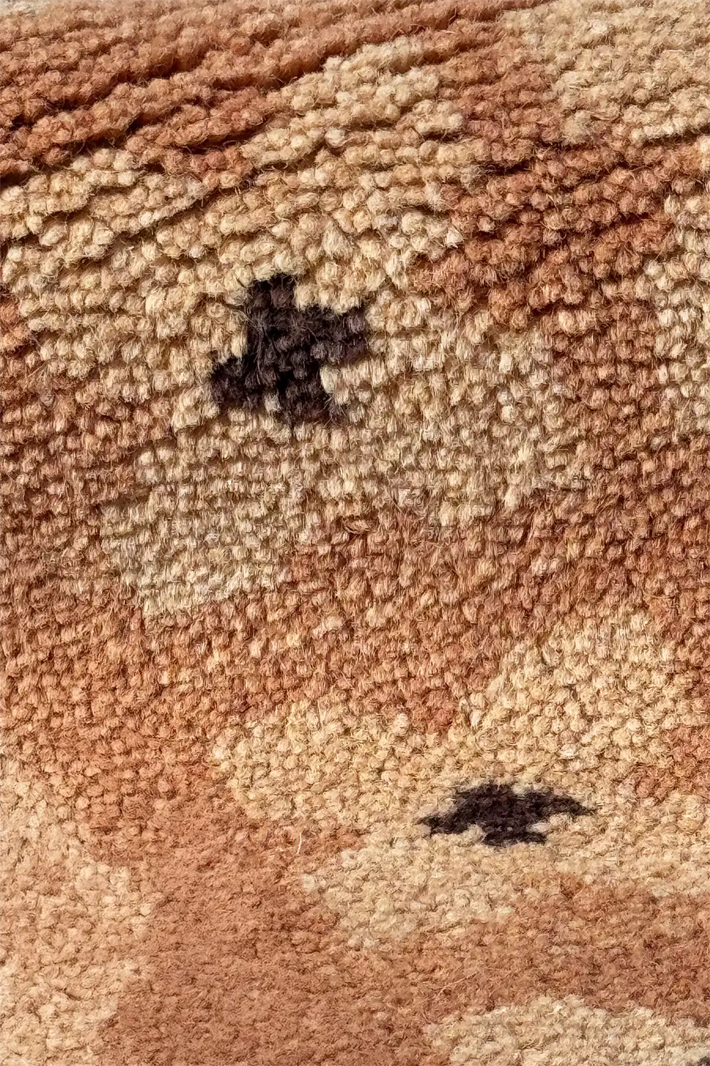 Detailed close-up of geometric wool runner rug featuring taupe and rust tones with black star motifs, perfect for narrow spaces