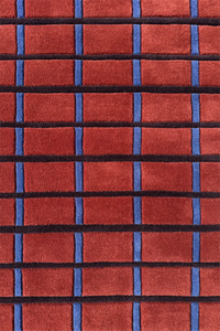 rust, blue, and black grid pattern on a wool hand tufted area rug