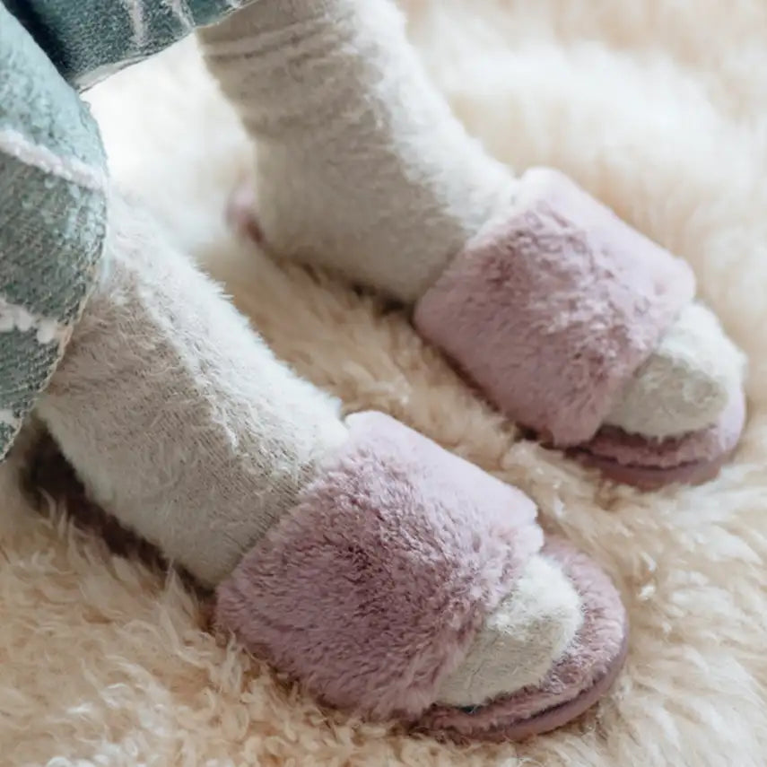 feet in slippers standing on a plush wool shaggy rug for comfort