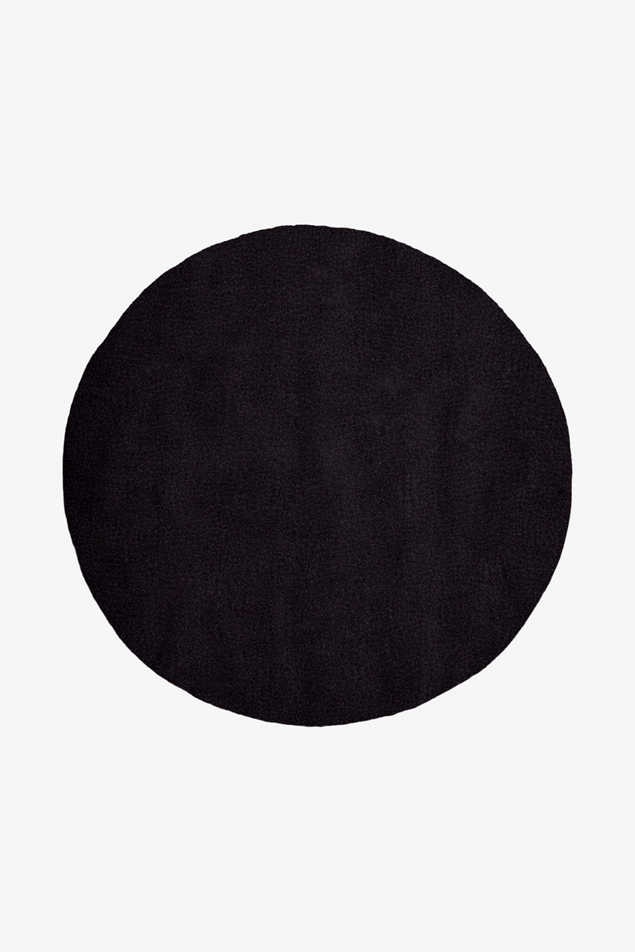 solid black round rug on a white background