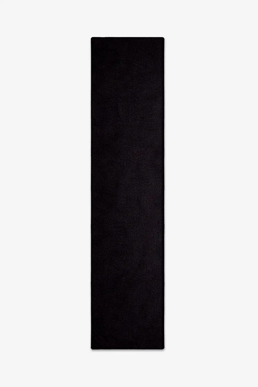 solid black wool runner rug on a white background