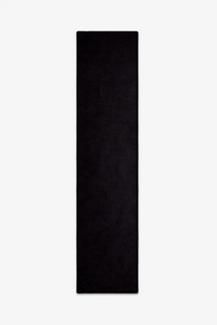 solid black wool runner rug on a white background