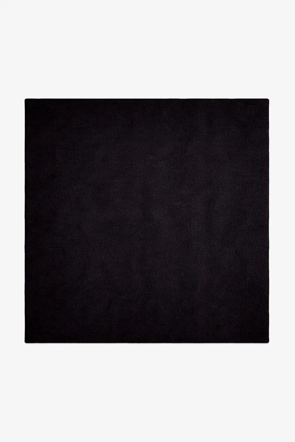 Solid black square rug hand-tufted in wool on a white background