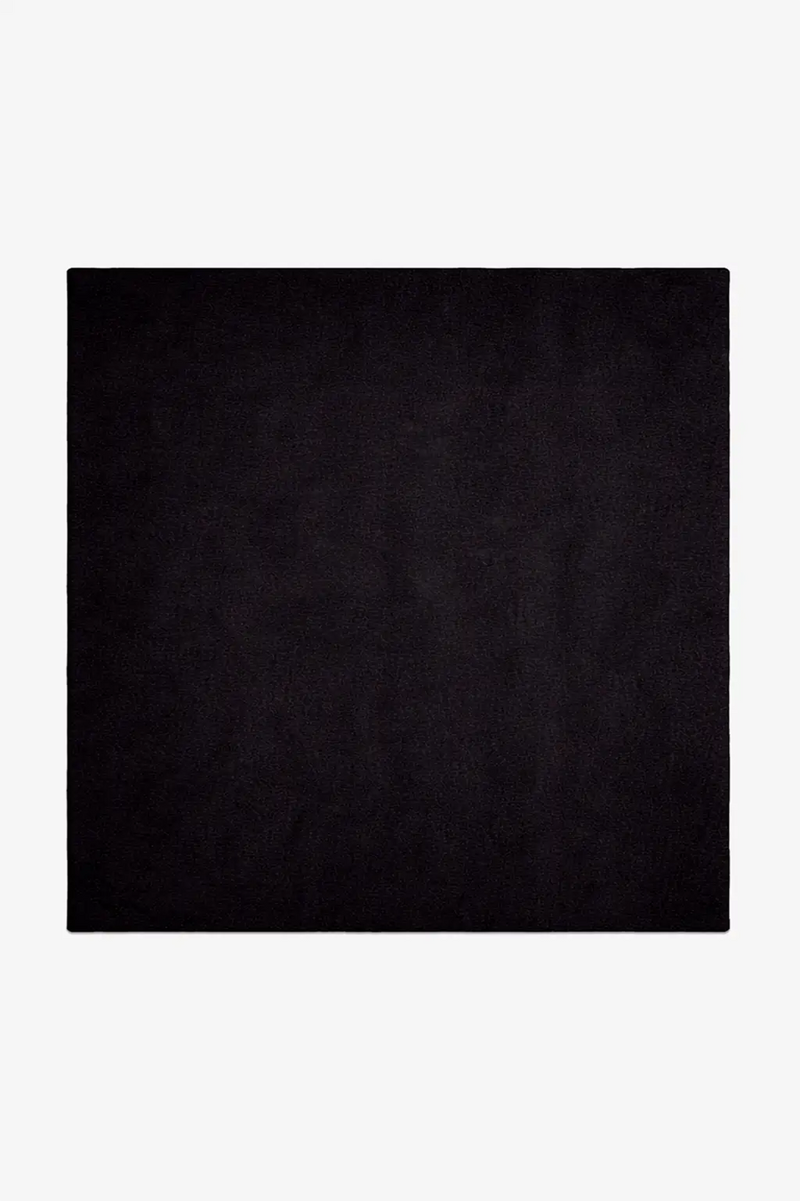 Solid black square rug hand-tufted in wool on a white background