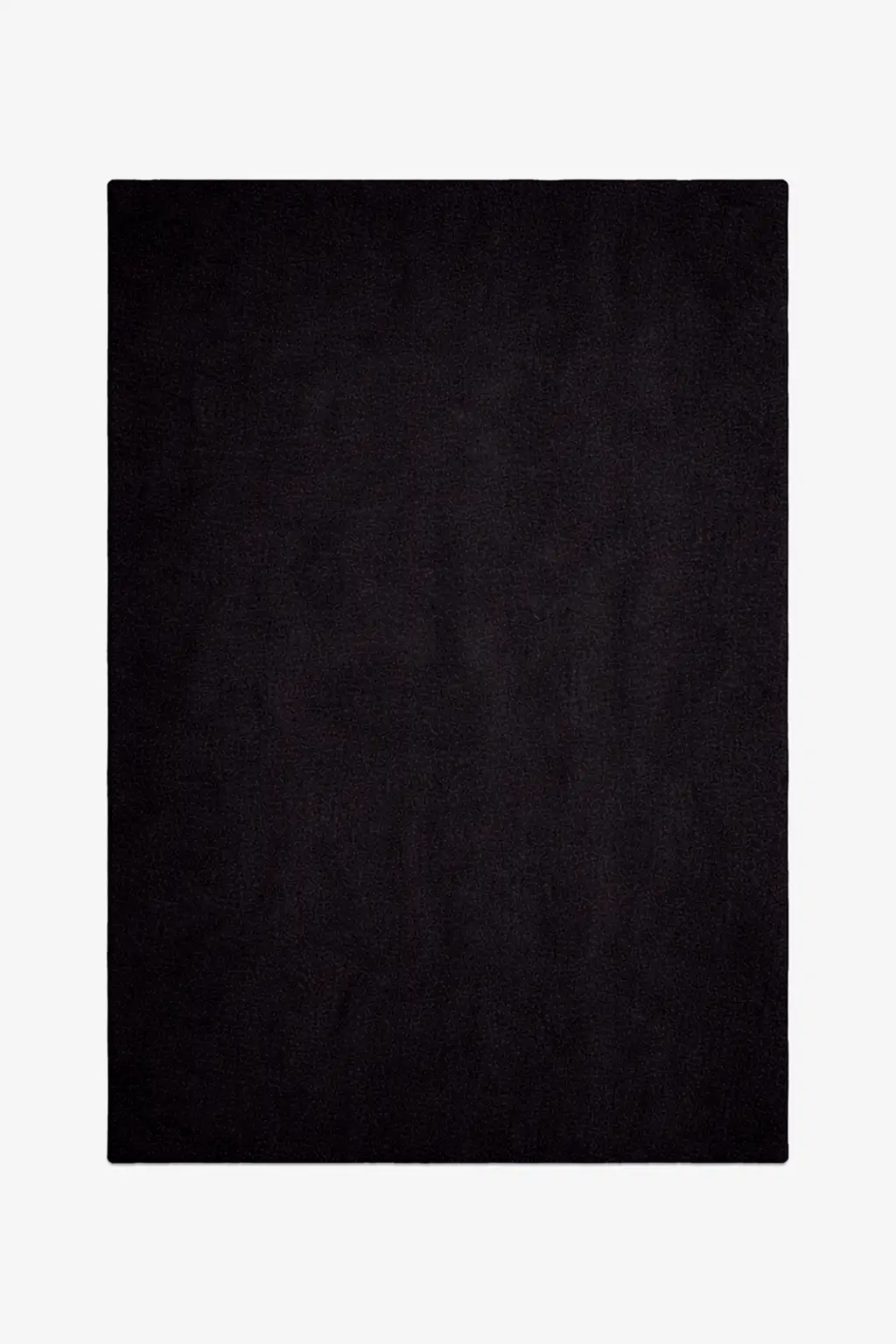 Solid black wool rug on a white background