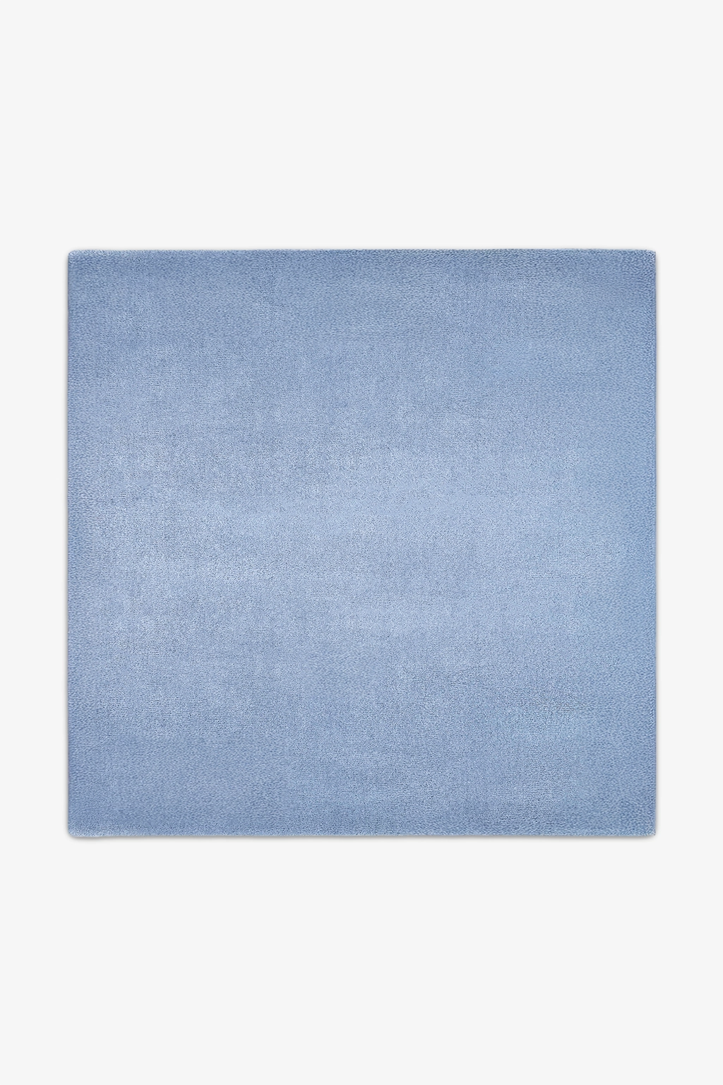 Solid light blue square rug on a white background
