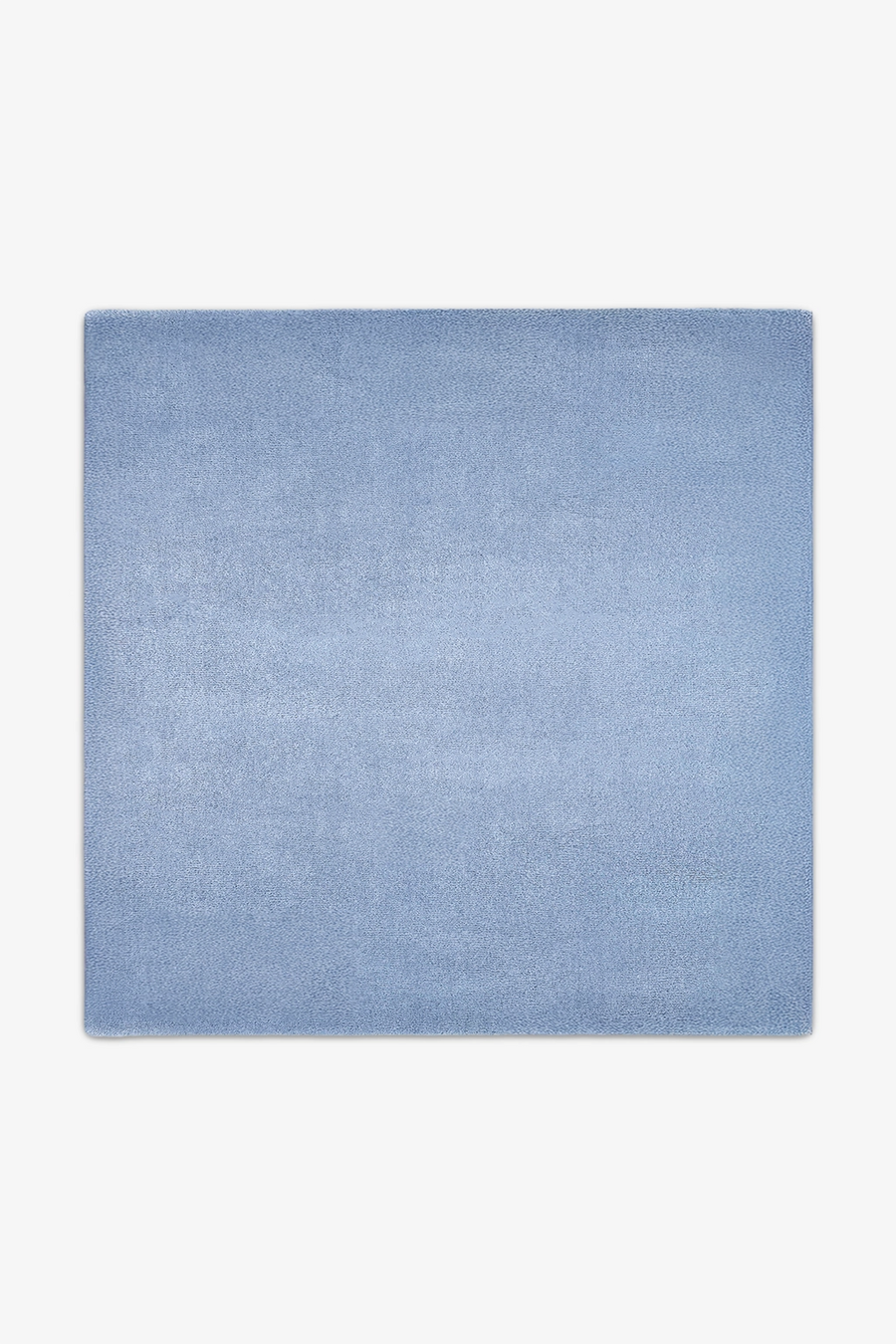 Solid light blue square rug on a white background