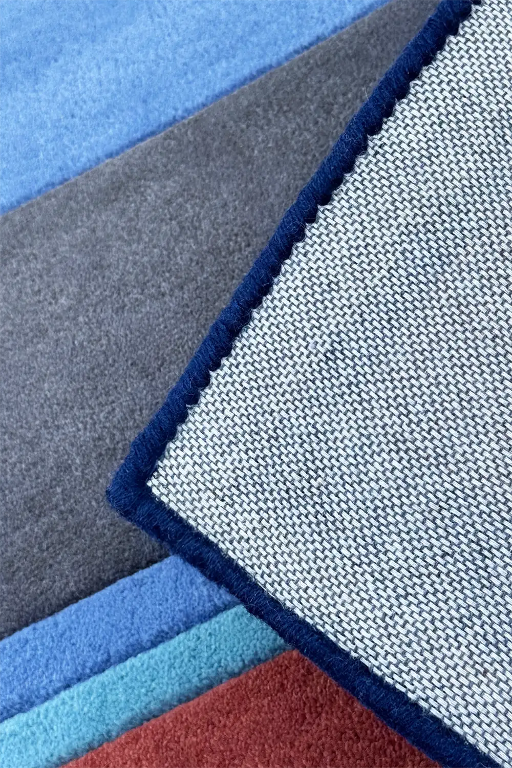close up of blue striped wool rug edge binding