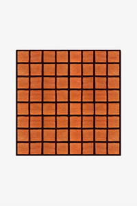 square wool rug with orange tiled pattern framed by deep burgundy wool gridlines