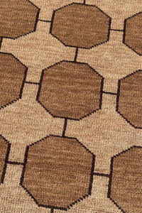 Close-up of a light tan taupe geometric patterned rug