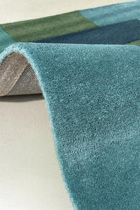 Luxurious boho area rug with thick pile and vibrant multicolor patchwork design