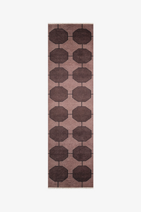 Long dark brown runner rug with a geometric pattern on a white background