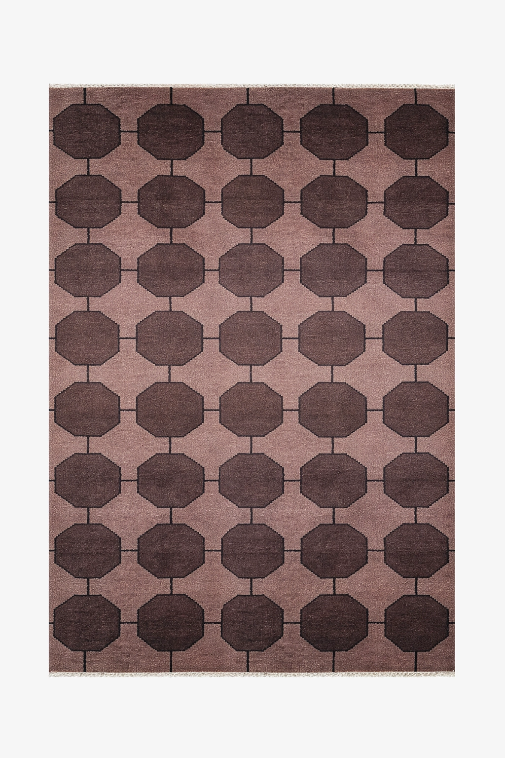 dark brown patterned rug with geometric design on a plain background