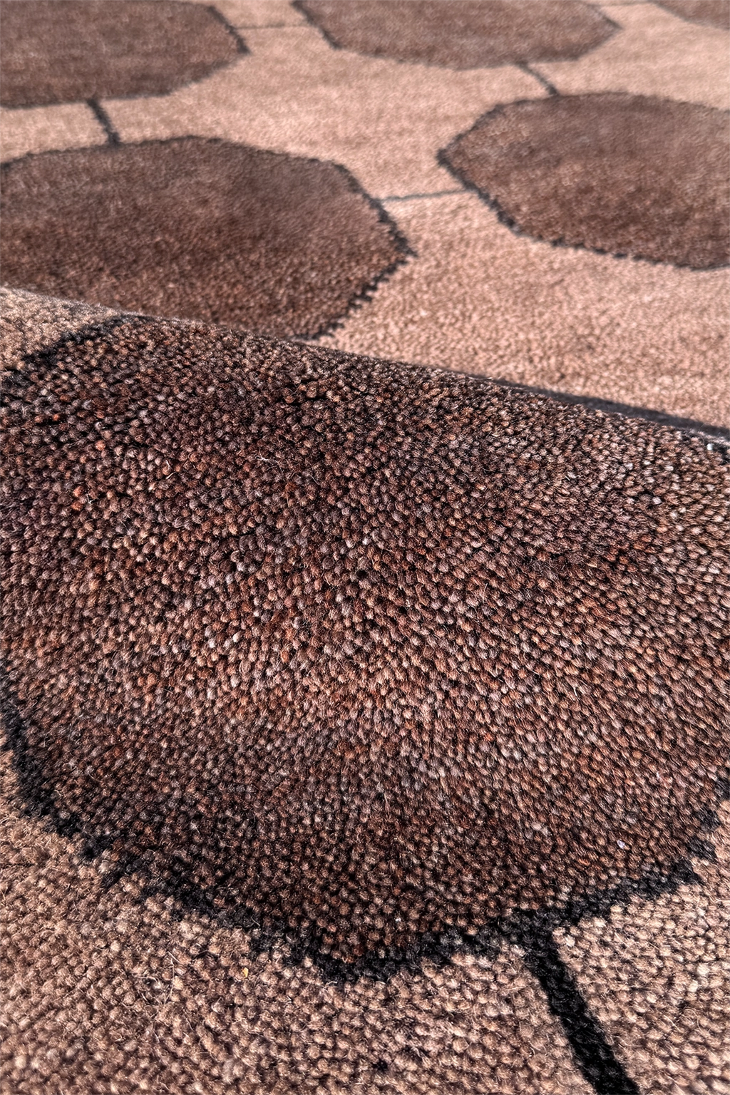Close-up of walnut textured rug with geometric pattern