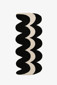 unique runner rug with black and beige wavy pattern on a white background