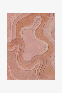 A rectangular area rug with an abstract, layered topographic contour pattern in rust shown flat against a light gray background.