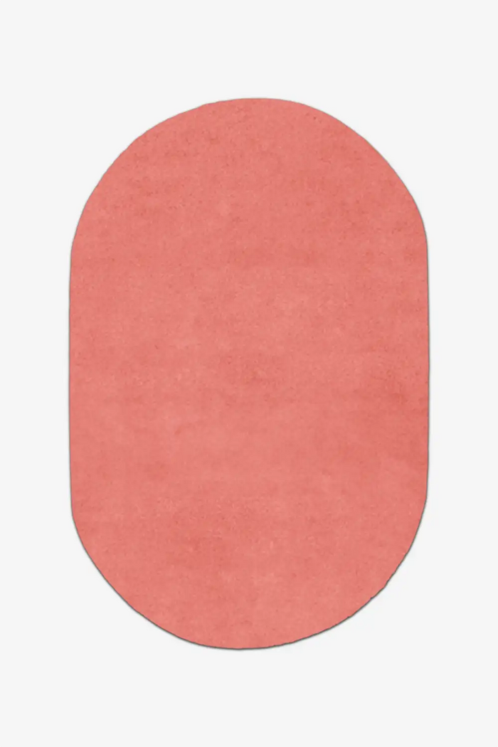 salmon pink oval rug on a white background in custom sizes