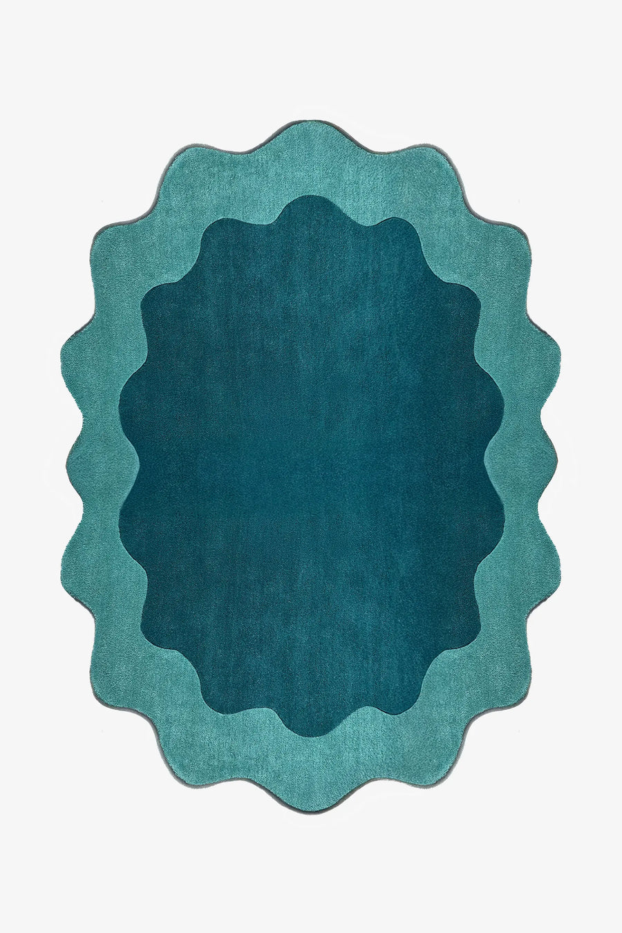 Teal and turquoise scalloped edge rug with abstract curved silhouette, a bold 8x10 oval area rug for living rooms or bedrooms
