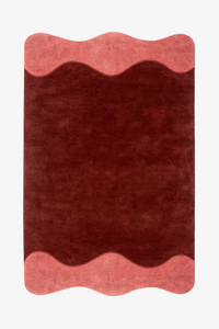 A rectangular area rug with a wavy scalloped border, featuring a deep burgundy rust  center and dusty salmon pink borders on the top and bottom, shown flat against a white background.