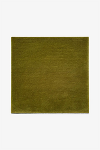 Solid olive green square wool rug on a white background