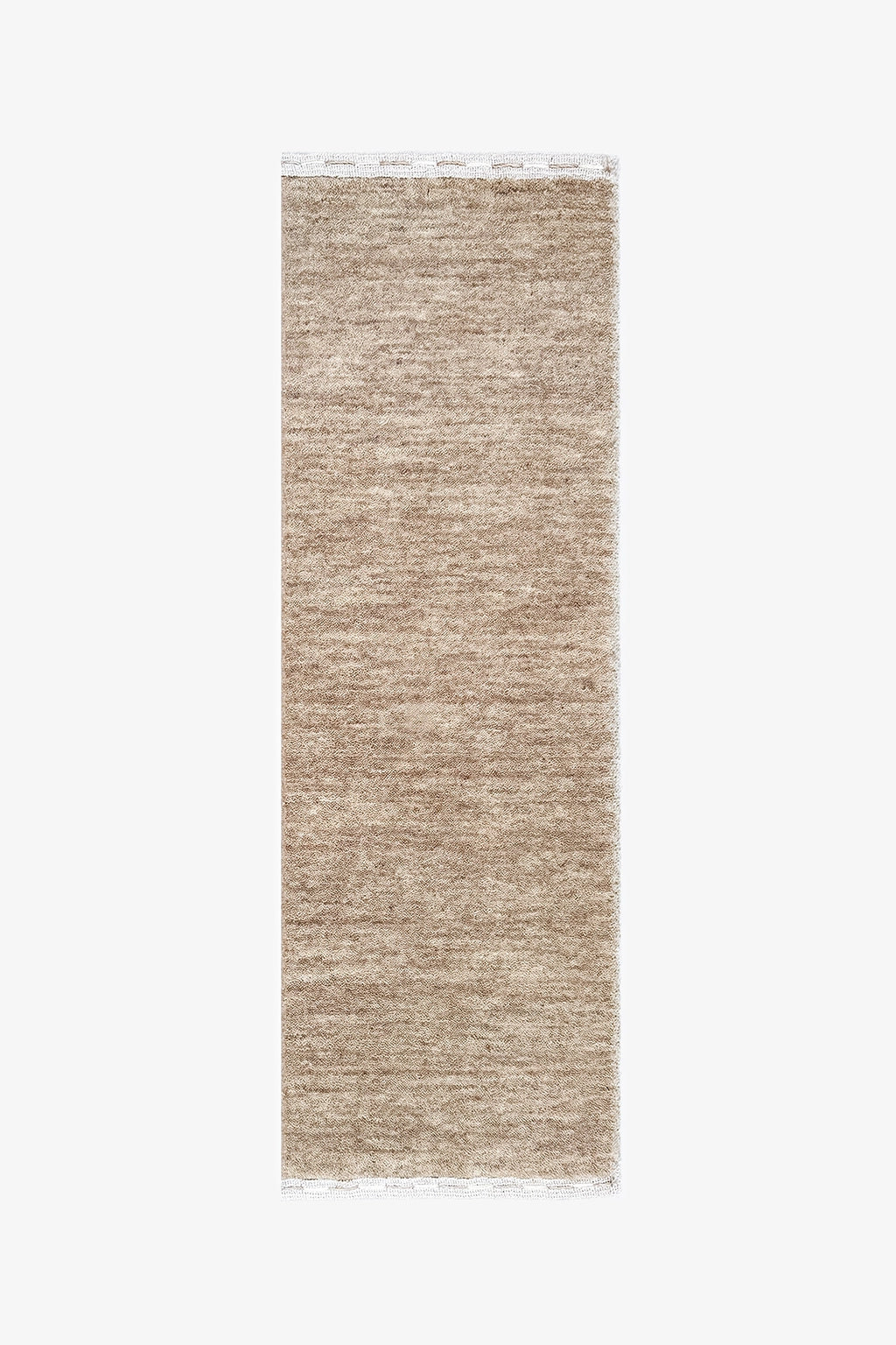 A neutral runner rug with a textured, heathered woven pattern in shades of beige and light brown, featuring white fringe on the top and bottom edges, shown against a plain white background stone