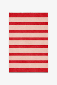 Striped red and beige rug on a white background