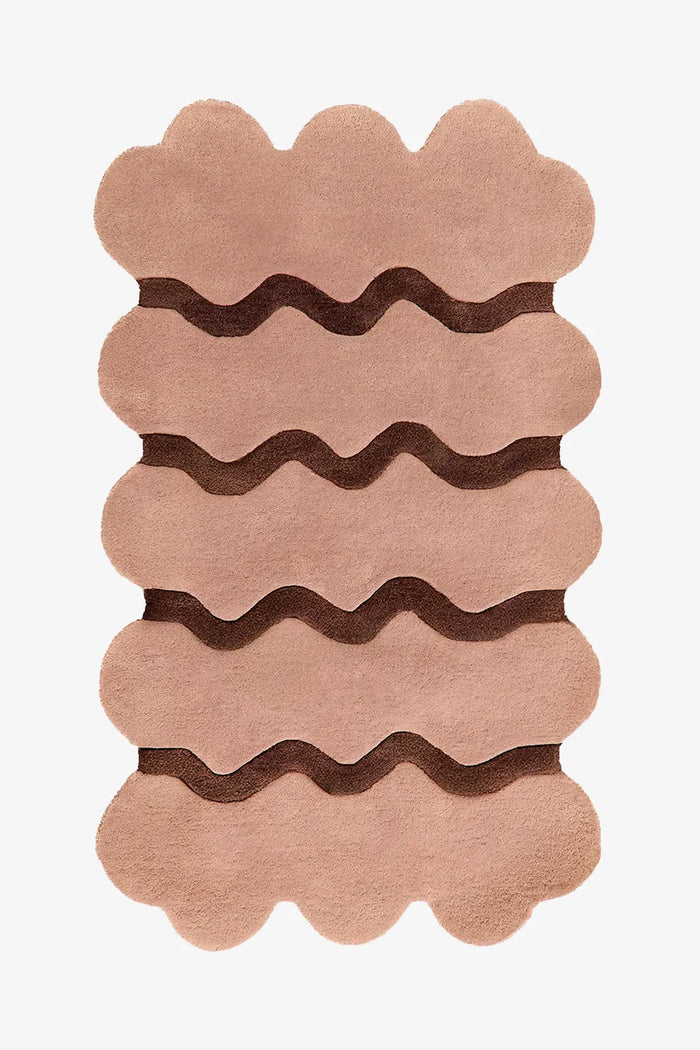 Neutral tan wool rug with dark brown ripple stripes, modern scalloped edge rug perfect for mid century living rooms